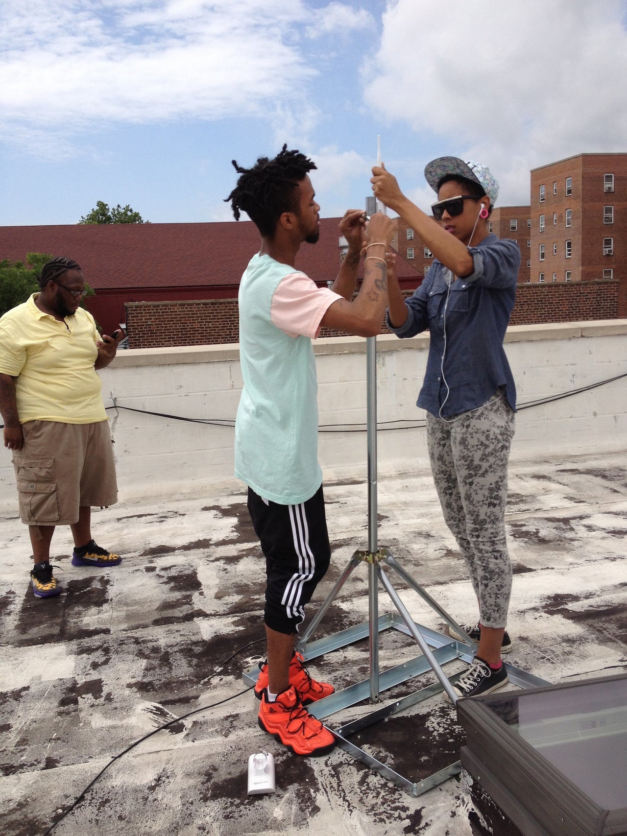 Red Hook Initiative digital stewards install a Red Hook wireless router on Red Hook Initiative’s roof in 2013.