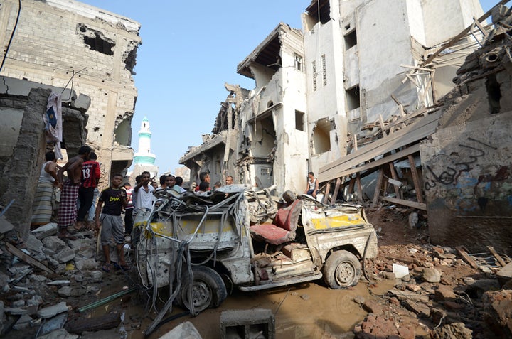 People gather at the site of a Saudi-led airstrike in the Red Sea port city of Hodeidah, Yemen, on Sept. 22, 2016.