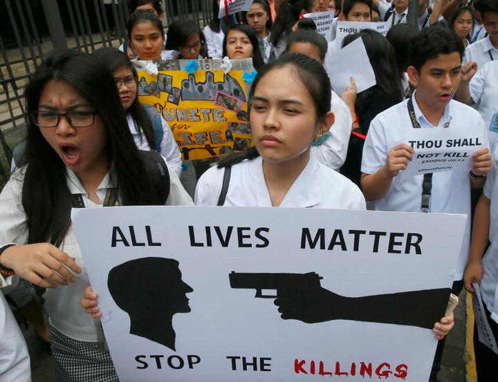<strong>Students in Manila display placards as they protest the killings being perpetrated in President Dutarte's unrelenting war on drugs and crime </strong>