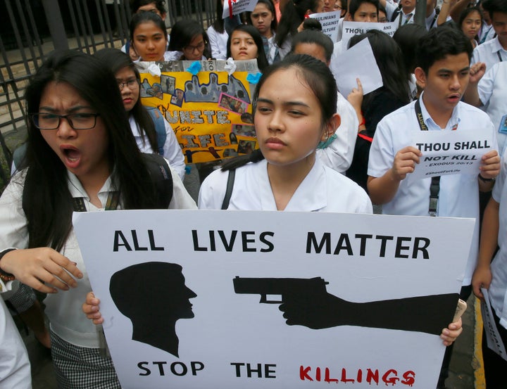 Students in Manila display placards as they protest the killings being perpetrated in President Dutarte's unrelenting war on drugs and crime 