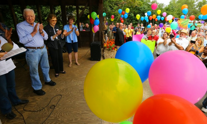 Jimmy Carter and former first lady Rosalynn Carter applaud while celebrating the 39th president's 90th birthday in Plains, Ge