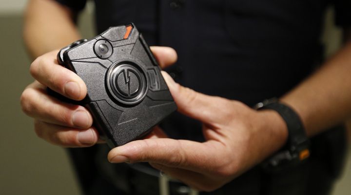 Los Angeles Police Department Officer Jim Stover demonstrates the use of a body camera during a training session at Mission Station on August 31, 2015 in Los Angeles, California.