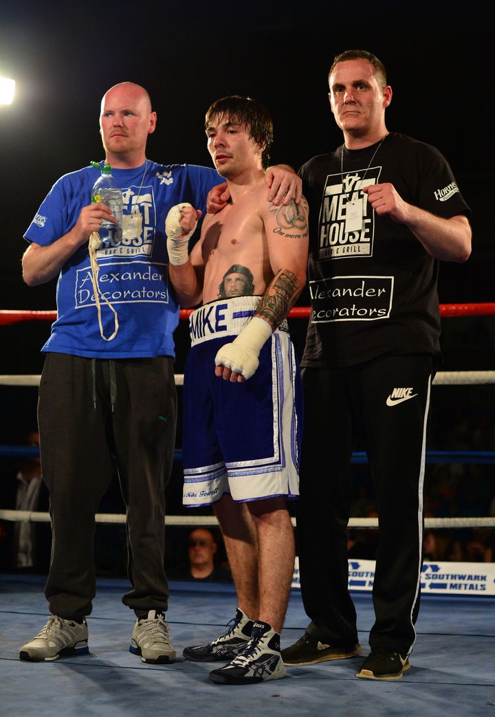 <strong>Towell [centre] after beating Danny Little in May</strong>