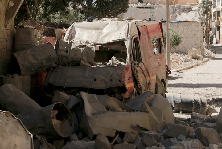 A destroyed ambulance is seen after a barrel bomb strike by Syrian regime forces over Sahra Hospital in Sahur neighborhood of