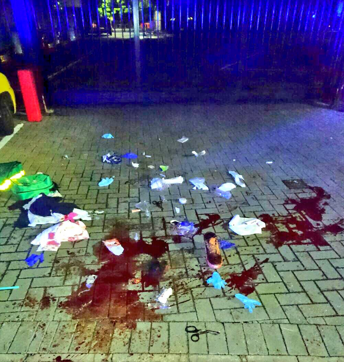 The aftermath of a stabbing in north London that left a young man with suspected 'life changing' injuries