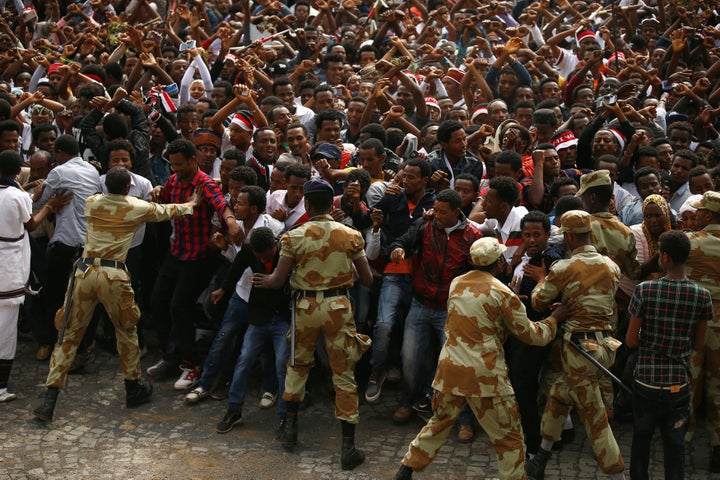 Demonstrators chant slogans while flashing the Oromo protest gesture during Irreecha, the thanksgiving festival of the Oromo people, in Bishoftu town, Oromia region, Ethiopia, October 2, 2016.