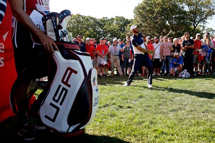 Oct 2, 2016; Chaska, MN, USA; Dustin Johnson of the United States chips in on the 16th hole during the single matches in 41st Ryder Cup at Hazeltine National Golf Club. (Rob Schumacher-USA TODAY Sports)