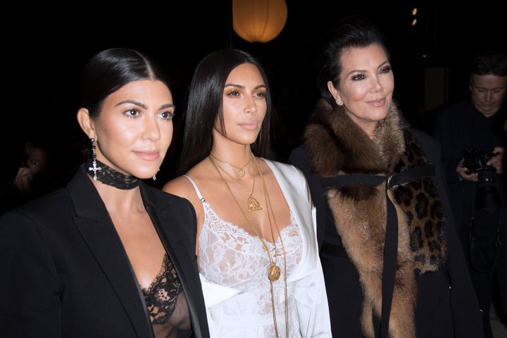 Kourtney Kardashian, Kim Kardashian and Kris Jenner attend the Givenchy show.