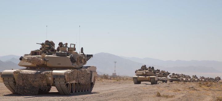 Abrams tanks train in the desert for the possibility of "decisive action."