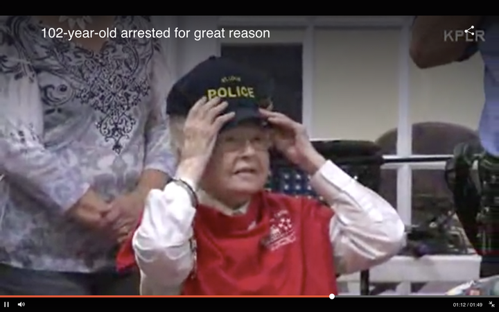 The do-gooder is seen trying on a St Louis Police Department hat after handing out handmade gifts to some of the senior center's guests.