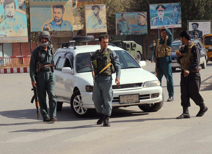 Afghan policemen keep watch in the downtown of Kunduz city, Afghanistan October 3, 2016.
