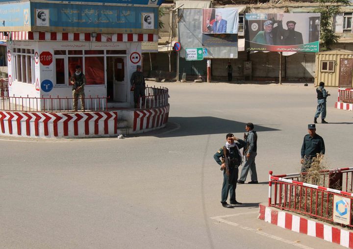 Afghan policemen keep watch at the downtown of Kunduz city, Afghanistan October 3, 2016.
