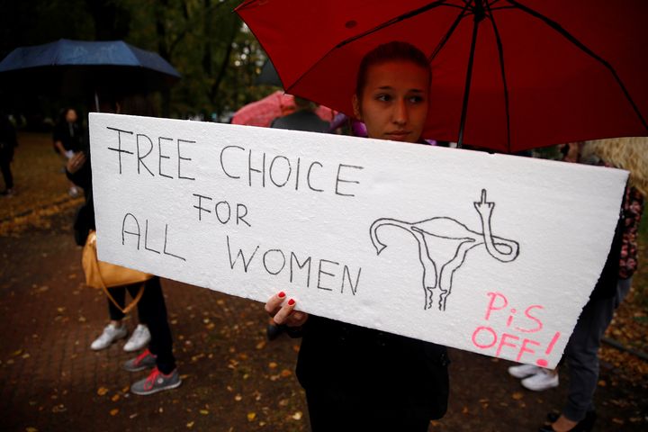 A woman holds a placard in an abortion rights campaigners' demonstration to protest against plans for a total ban on abortion.