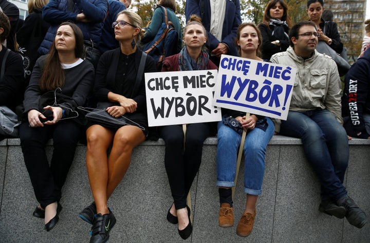 Women hold placards as they take part in an abortion rights campaigners' demonstration.