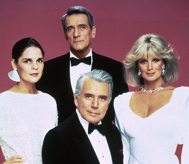 Rock Hudson (center back) poses with fellow "Dynasty" cast members John Forsythe, Linda Evans (right) and Ali MacGraw (left) in 1985.