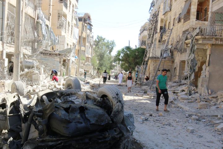Survivors after an airstrike in the Seif al-Dawla neighborhood of Aleppo in Syria last week.