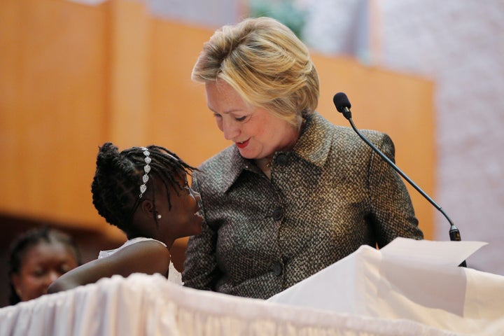 Nine-year-old Zianna Oliphant joins U.S. Democratic presidential nominee Hillary Clinton at the pulpit at the Little Rock AME
