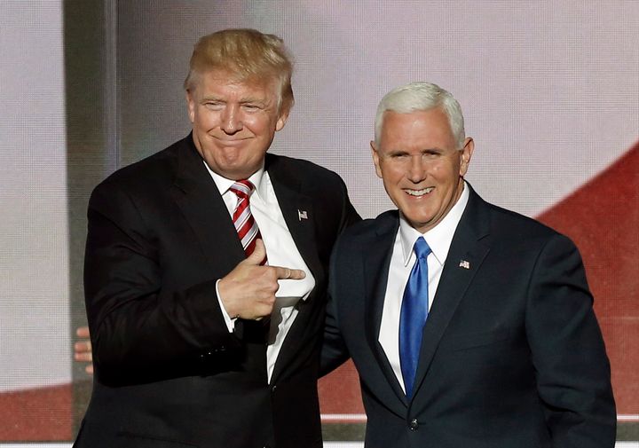 Republican U.S. presidential nominee Donald Trump (L) greets vice presidential nominee Mike Pence after Pence spoke at the Republican National Convention in Cleveland, Ohio, U.S. July 20, 2016.