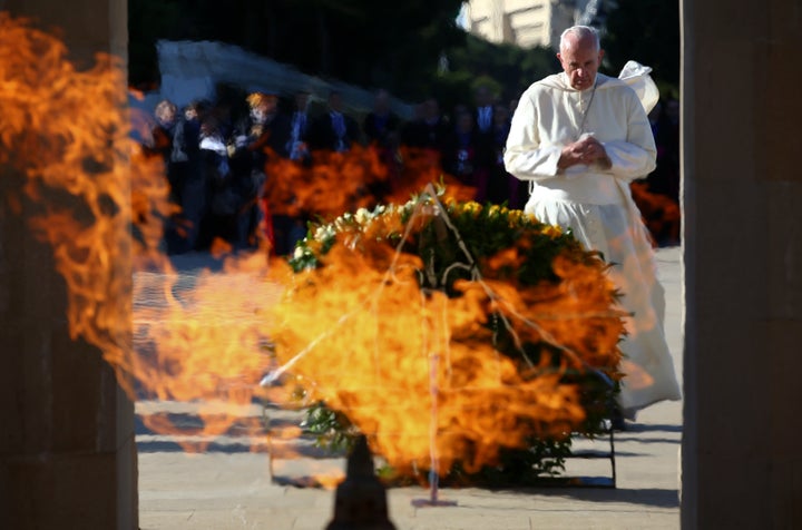 Pope Francis prays at the Azerbaijan Baku City Shadhidlar Hiyabani Monument to the Fallen Heroes on Oct. 2. 