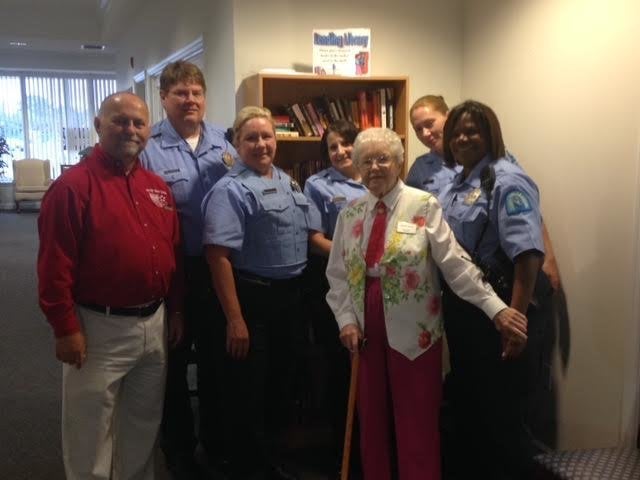 Simms is seen posing with some of the police officers that made her special day happen.