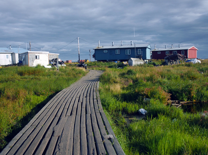 Wooden boardwalks serve as roads for the small village of Newtok.