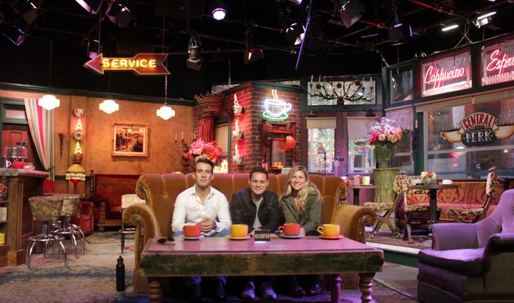 L-R: Nick McLoughlin, Joseph Mango, and Miranda Wynne visited the Friends’ Central Perk set on the Warner Bros. Studio Tour
