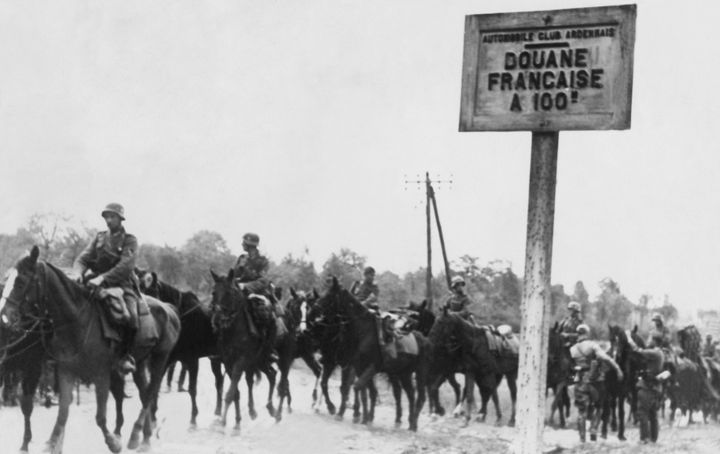 A German mounted reconnaissance unit leaving the Ardennes, crossing the Belgian border to France 