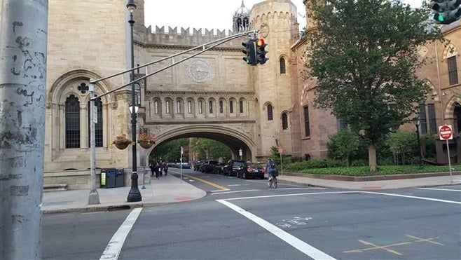 A New Haven city street leads to the Yale campus. Some states and cities are considering a property tax on nonprofits like Ya