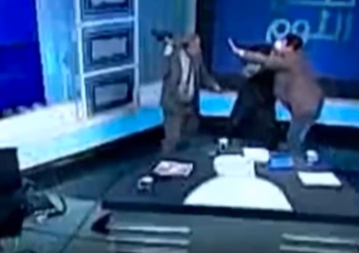 Egyptian lawyer Nabih al-Wahsh attacks Australian imam Mostafa Rashid with his shoe during a live broadcast in Egypt
