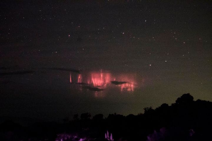 A photograph showing the sky above Hurricane Matthew on Saturday captured rare red bursts of light, called sprites, as well as faint gravity waves in the sky above it.