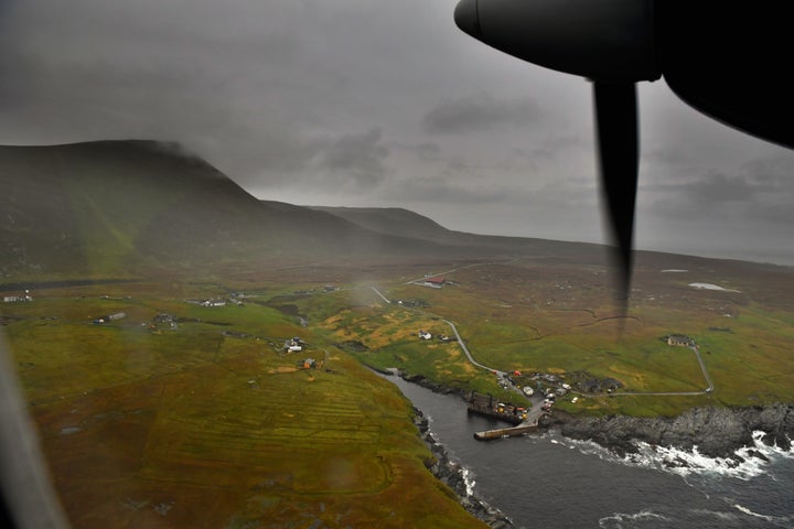 A plane arrives on the Foula airstrip