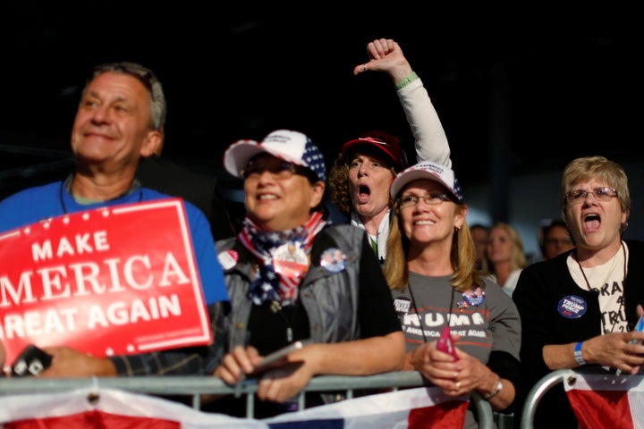 People jeer Hillary Clinton as Republican presidential nominee Donald Trump holds a rally at the Suburban Collection Showplace in Novi, Mich., on Sept. 30.