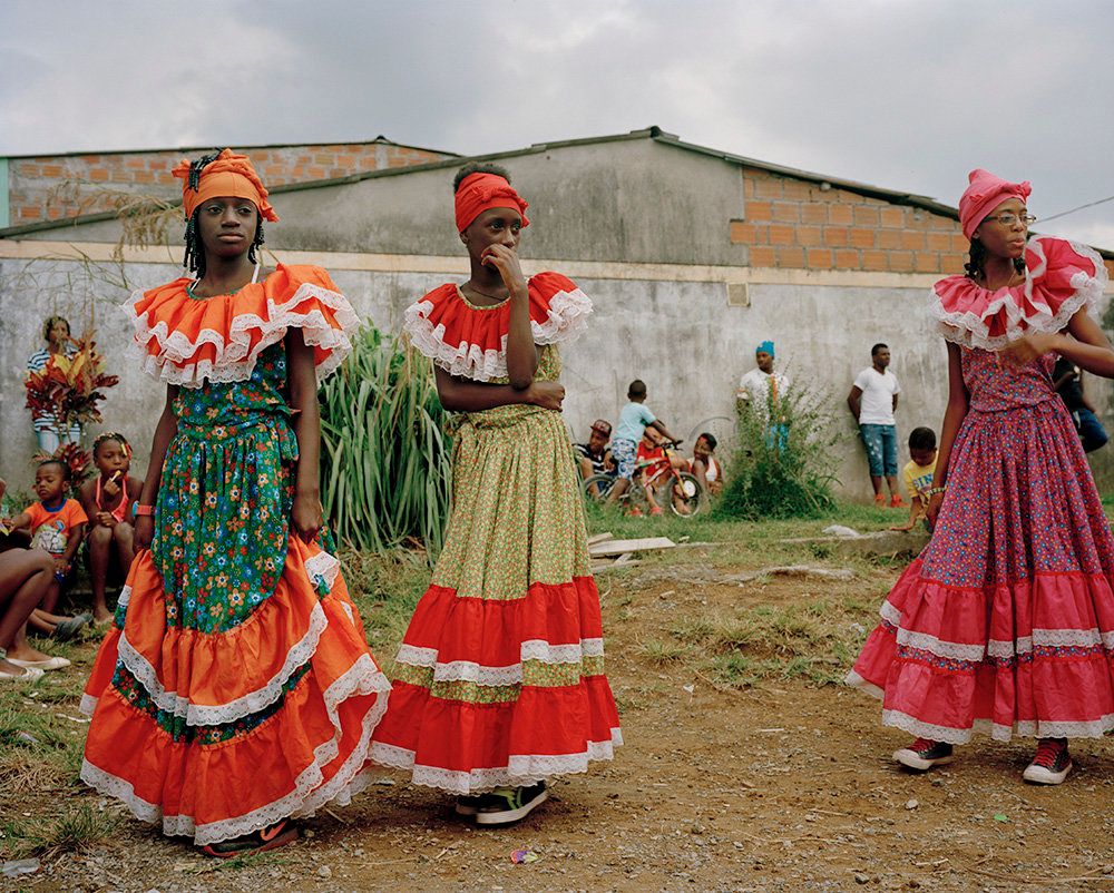 Afro-Colombian youth prepare to perform for a small community that hosts many displaced families.