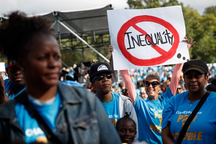 Parents, schoolchildren and education activists rally during an event supporting public charter schools and protesting New York's racial achievement gap in education. 