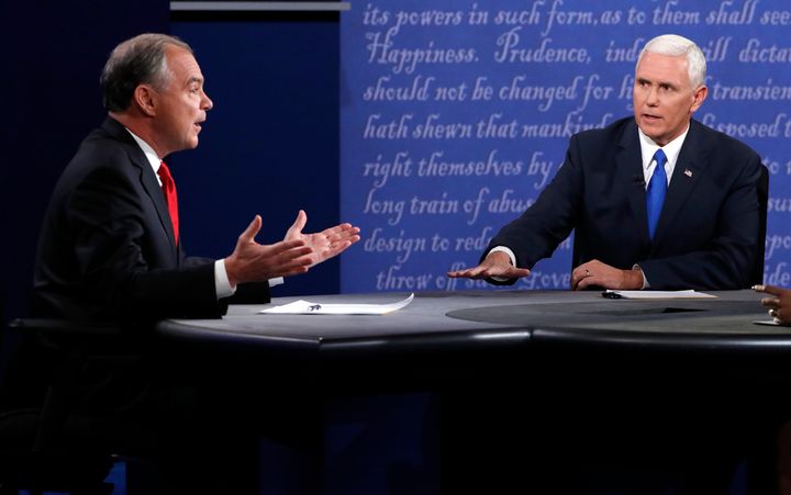 Democratic U.S. vice presidential nominee Senator Tim Kaine (L) and Republican U.S. vice presidential nominee Governor Mike Pence discuss an issue during their vice presidential debate at Longwood University in Farmville, Virginia, U.S., October 4, 2016.