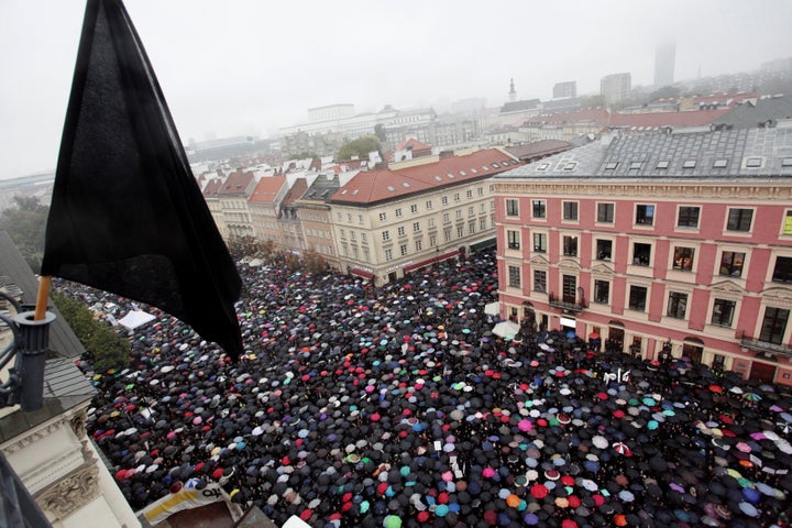 Thousands of people gather during an abortion rights campaigners' demonstration to protest against plans for a total ban on abortion in front of the Royal Castle in Warsaw, Poland October 3, 2016.