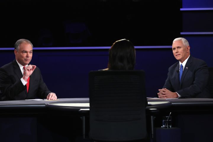 Democratic vice presidential nominee Tim Kaine and Republican vice presidential nominee Mike Pence debate as moderator Elaine Quijano listens during the Vice Presidential Debate at on Oct. 4.
