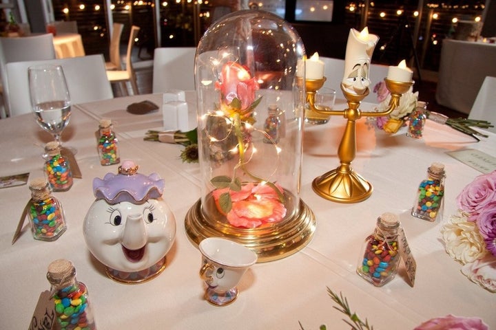 "Beauty and the Beast" table decorated with an enchanted rose. Guest appearances by Lumiere, Mrs. Potts and Chip. 