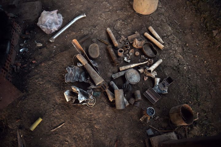 Aluminum objects, including bomb parts, waiting to be melted into raw pieces of jewelry ordered by U.S. fashion brand Article22 at the workshop of a Laotian villager and artisan.