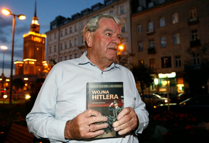 The real David Irving, holding the Polish-language version of his book "Hitler's War." Irving is brilliantly portrayed by actor Timothy Spall in "Denial."