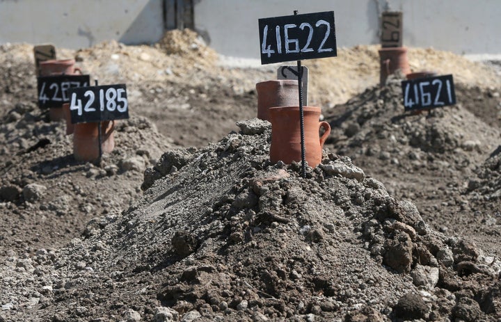 Tombstones are placed on graves of unidentified 85 refugees, mostly women and children, who drowned at sea during an attempt to cross part of the Aegean Sea from the Turkish coast at Dogancay Cemetery in Izmir, Turkey, on April 4.