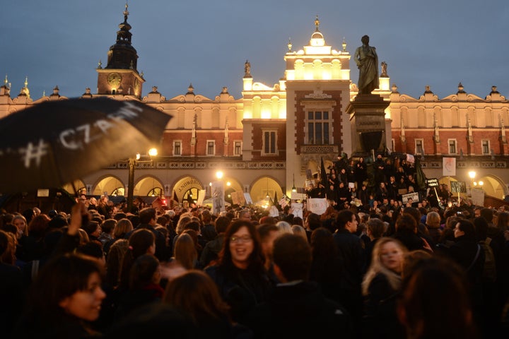 Thousands of people protest against the proposed abortion laws on Debnicki Square, in Krakow, Poland, on Monday.
