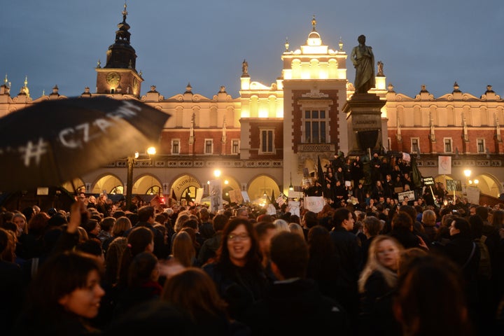 Thousands of people protest against the proposed abortion laws on Debnicki Square, in Krakow, Poland, on Monday.