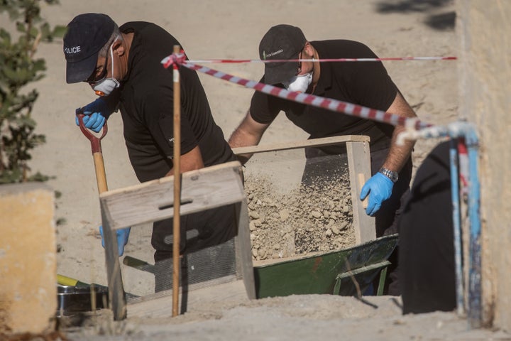 South Yorkshire Police sift through soil removed from underneath the last room of the farmhouse