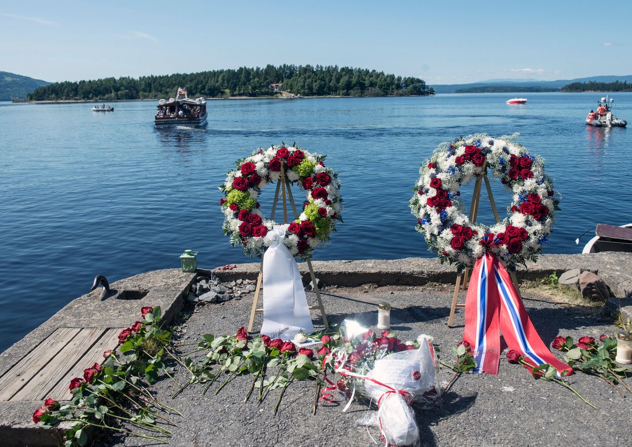 A wreath laying ceremony marks the second year anniversary of the twin Oslo-Utoya massacre. The boat "Thorbjorn" which carried Breivik to Utoya can be seen in the background.