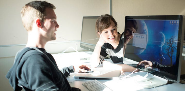 Students working on a computer together