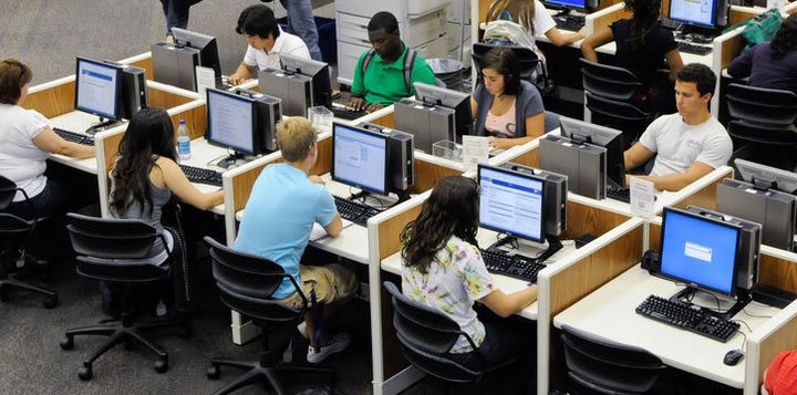 Students on computers at a library