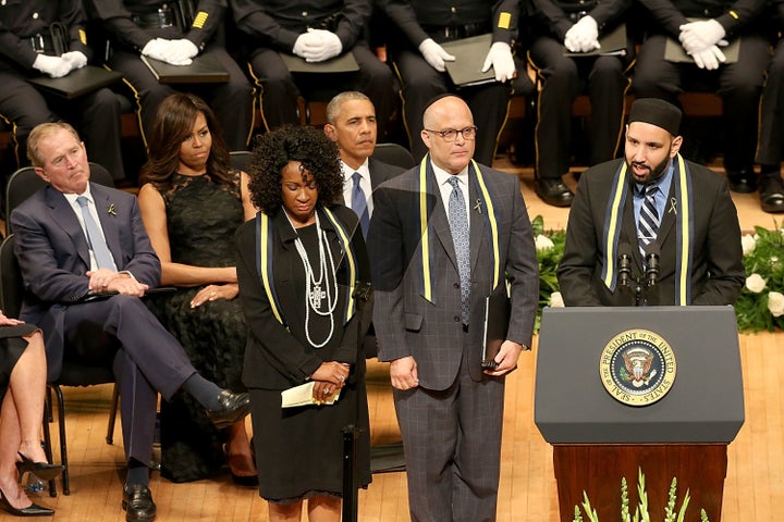 President of the United States Barack Obama looks on as prayers are given by Rev. Dr. Sheron Patterson, Imam Omar Suleiman and Rabbi Andrew Marc Paley during the Interfaith Memorial honoring the Dallas shooting victims at The Morton H. Meyerson Symphony Center on July 12, 2016 in Dallas, Texas.