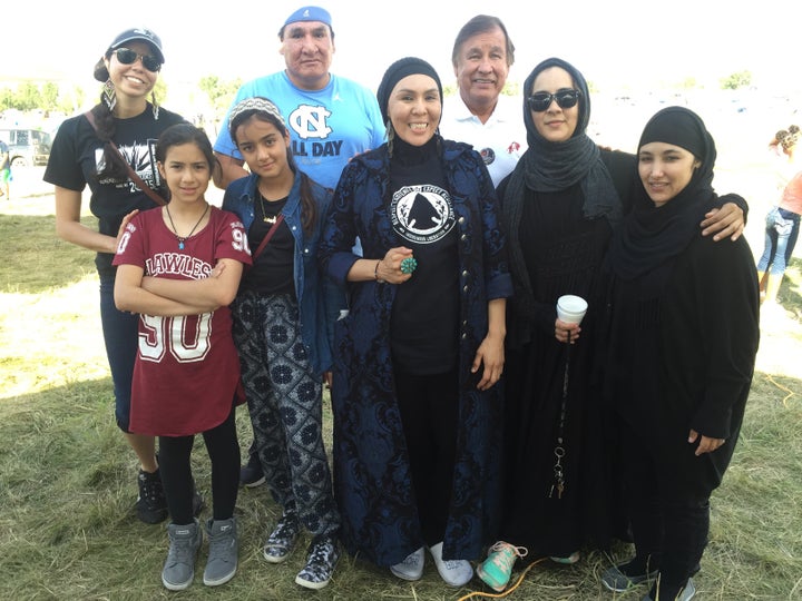 Leslie Henderson Oajaca (front row, second from right) stands with a group of indigenous Muslims who visited Sacred Stone Cam