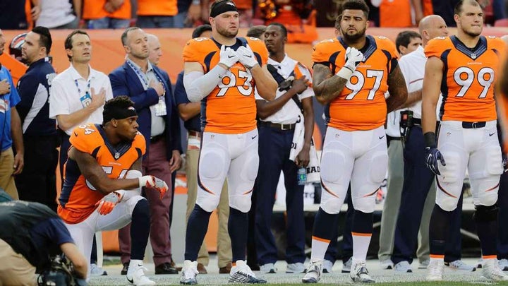 Denver Broncos linebacker kneels during National Anthem